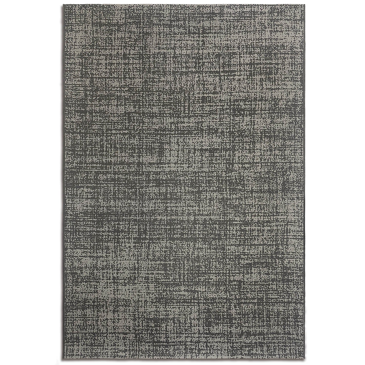 A flatwoven indoor/outdoor rug with a random gravel pattern in a smoke color.